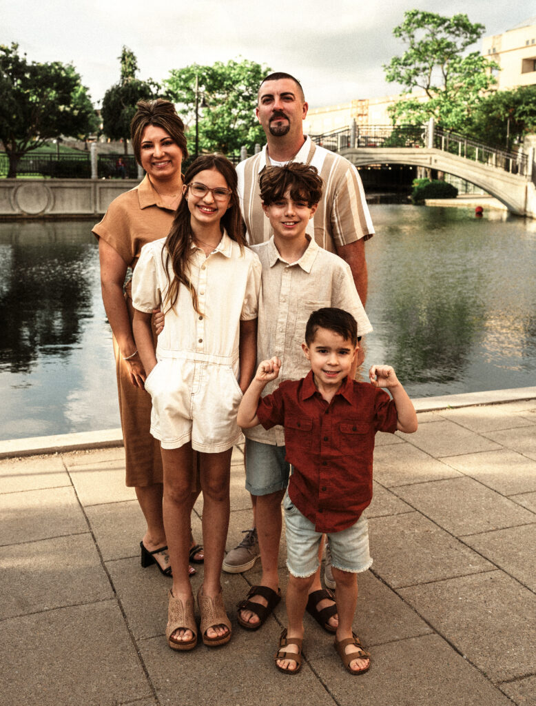 Family posing in front of the Indianapolis canal