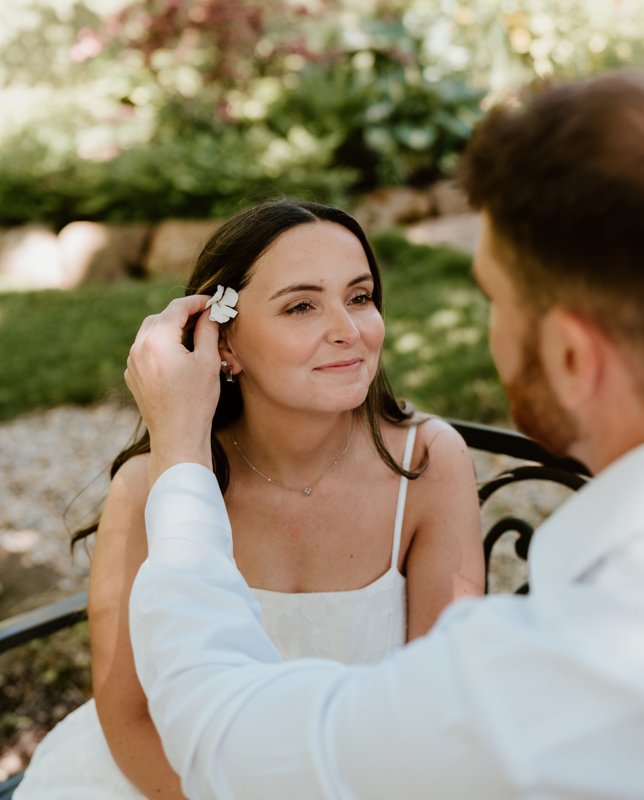 Couple posing for engagement photos at Avon Gardens